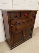 An oak side cabinet with drawers and cupboard under (H99cm W90cm D45cm)