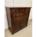 An oak side cabinet with drawers and cupboard under (H99cm W90cm D45cm)