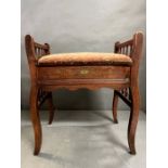 An inlaid piano stool with spindle sides