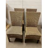 Four wicker dining chairs