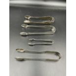A selection of four silver sugar tongs: 1824 William Chawner, 1827 William Eley, 1867 Charles