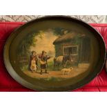 An oval Papier Mache tea tray decorated with family scene