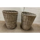A pair of wicker baskets