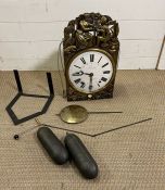 A French Morbler clock, reprousse case, weights and key