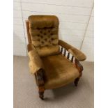 A Victorian mahogany adjustable open arm chair, upholstered arms on four turned supports