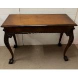 A mahogany console table with ball and claw feet (H89cm W122cm D48cm)