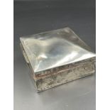 A silver cigarette box, hallmarked for Birmingham 1911