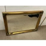 A gilt frame rectangular wall mirror (77cm x 106cm)