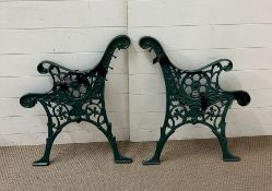 Two metal bench ends and a metal owl