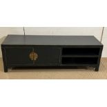 A black media unit by Dunelm Hanna (H46cm W130cm D40cm)