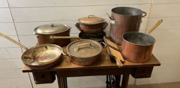 A selection of copper and brass kitchenware, some stamped