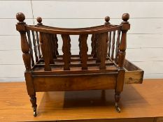 A regency style mahogany Canterbury, three divers turned legs