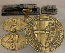 A brass "The Great Western Railway Company" plaque along other brass signage and model trains