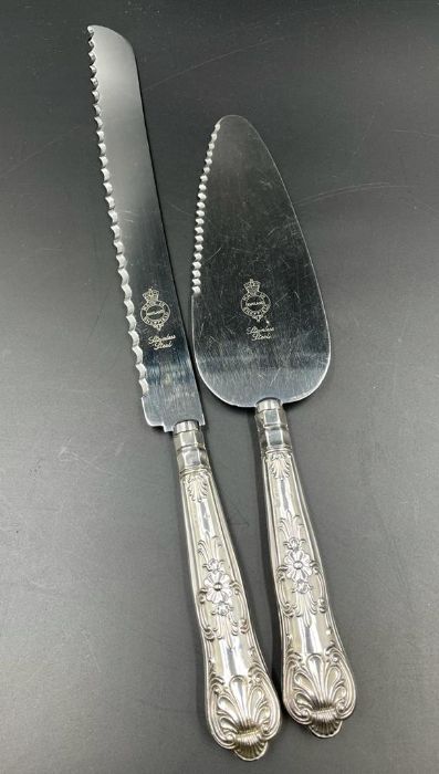 A silver handled cake slice and bread knife