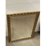 A gilt frame wall mirror