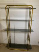 A contemporary metal frame and smoked glass shelving (H180cm W118cm D32cm)