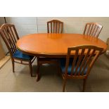 A Stag dining table with slat back chairs (H74cm W170cm D100cm)