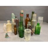 A selection of collectable antique bottles in various conditions and styles.