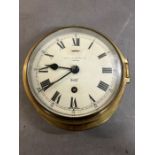 A brass ships/marine clock stamped Capt O.M Watts Ltd London Sestrel made in England