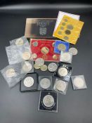 A selection of collectable coins to include a number of crowns, five pound coins, proof coinage of