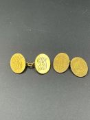 A Pair of 18ct gold gents cuff links (Total weight 12g)