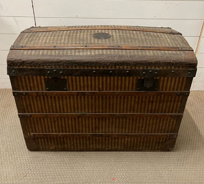 A canvas and a metal bound travel trunk (H65cm W86cm D50cm)