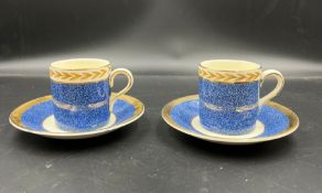 A pair of Crown Ducal coffee cans and saucers
