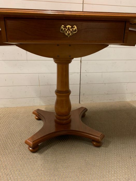 A drop sided side table with drawer to centre (Open W131cm H65cm) - Image 5 of 5