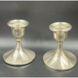 A Pair of silver candlesticks by S Blanckensee & Son Ltd, hallmarked for Birmingham 1935. (9cm H)