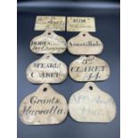 A set of eight late 19th Century wine cellar labels.