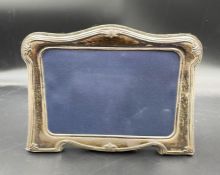A silver picture frame hallmarked for Sheffield 1997 by Carr's of Sheffield Ltd (Approx 14 cm x