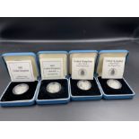 Four silver proof one pound coins to include 1989 and 1990.