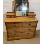 An antique pine chest of drawers with dressing table mirror (H78cm W106cm D48cm)