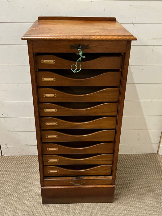 A Tambour fronted music cabinet (H104cm W50cm D43cm)