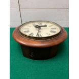 A mahogany wall clock