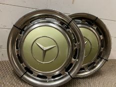 Four vintage Mercedes hub caps