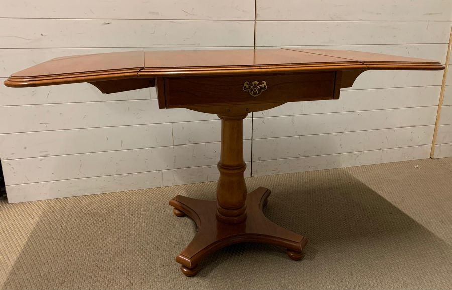 A drop sided side table with drawer to centre (Open W131cm H65cm) - Image 4 of 5