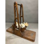 A vintage wooden toy swing (34cm x 30cm)