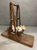 A vintage wooden toy swing (34cm x 30cm)