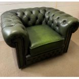 A green leather button back easy armchair Chesterfield