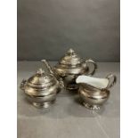 A Royal Worcester silver lustre teapot, sugar bowl and milk jug
