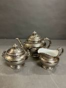 A Royal Worcester silver lustre teapot, sugar bowl and milk jug