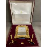 A cased Asprey silver,gilded, mirror and candlestick set.