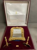 A cased Asprey silver,gilded, mirror and candlestick set.