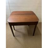 A mahogany folding tea table (70cm x 90cm)