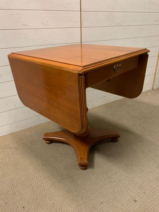 A drop sided side table with drawer to centre (Open W131cm H65cm) - Image 3 of 5