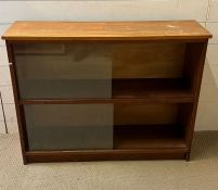 A Mid Century glazed bookcase (H76cm W100cm D29cm)