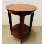 A circular side table with four supporting legs and shelf under (H60cm Dia45cm)