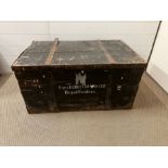 A large wooden and metal bound trunk, inscribed Captain E Chester Master Royal Fusiliers