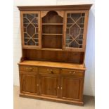 A pine Welsh dresser with glazed doors and base unit with drawers and cupboards (H206cm W150cm